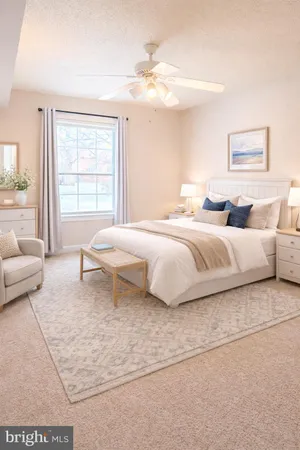 a bedroom with a large bed and a couch