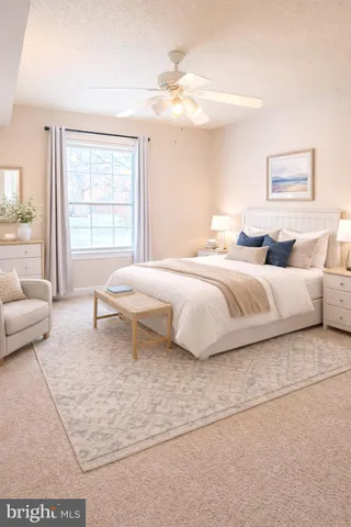 a bedroom with a large bed and a couch