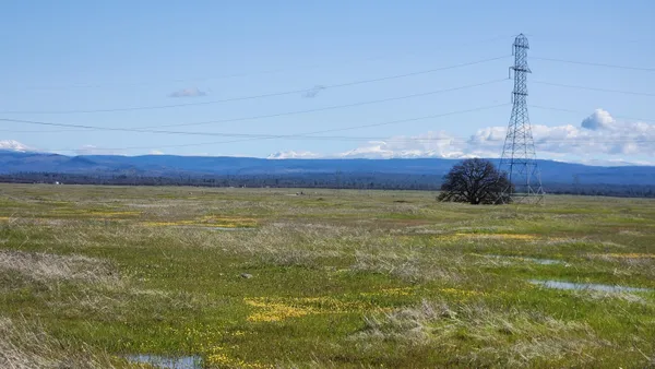a view of a room with a table and chairs