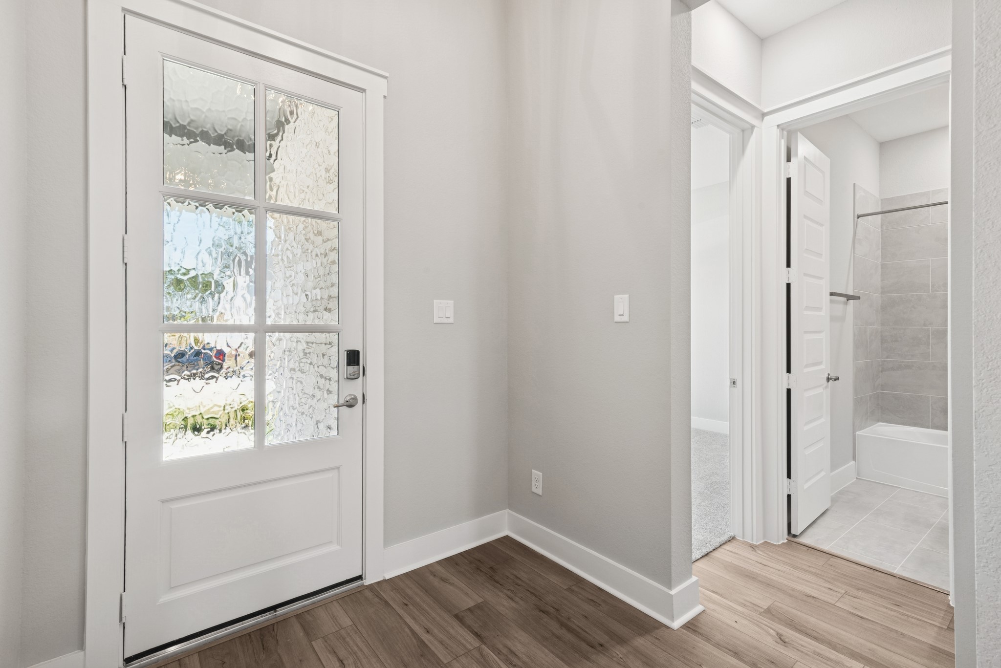 18623 Rumba Court Conroe, TX 77302 - Photo 13 of 48 a view of an empty room and wooden floor