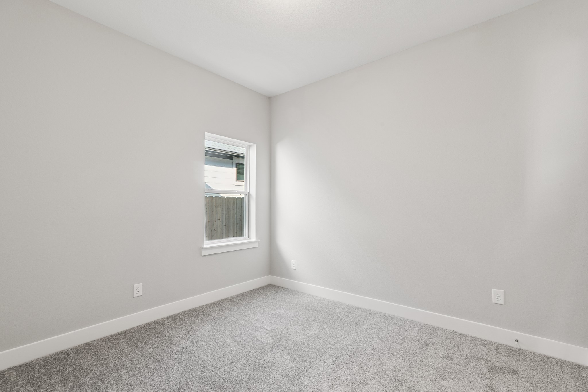 18623 Rumba Court Conroe, TX 77302 - Photo 17 of 48 an empty room with a window