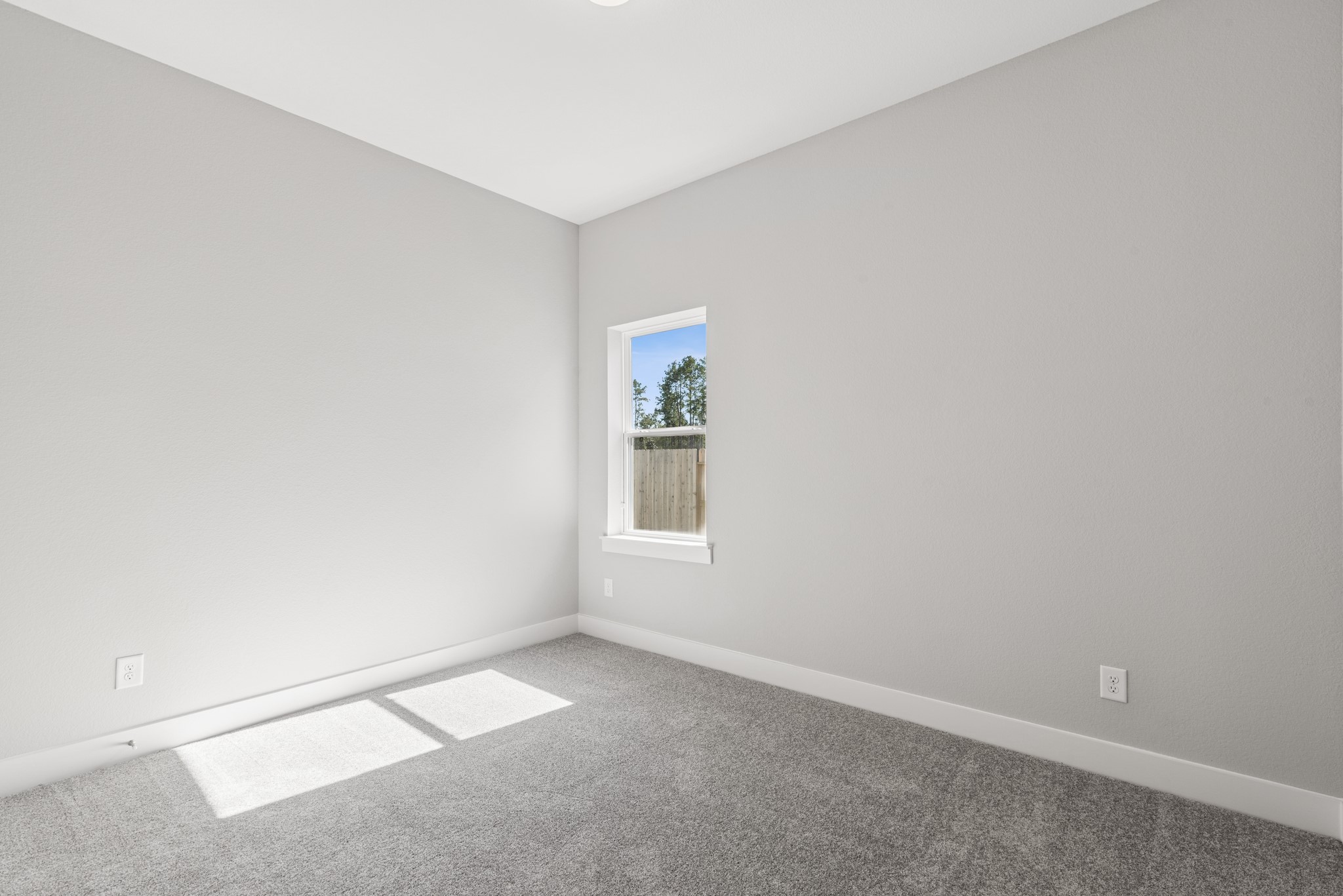 18623 Rumba Court Conroe, TX 77302 - Photo 19 of 48 an empty room with windows