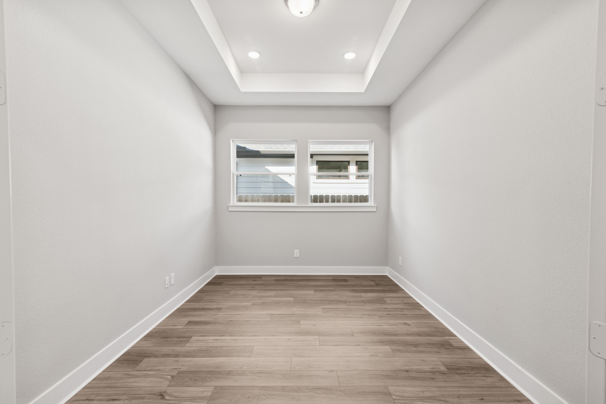 18623 Rumba Court Conroe, TX 77302 - Photo 23 of 48 an empty room with wooden floor and windows