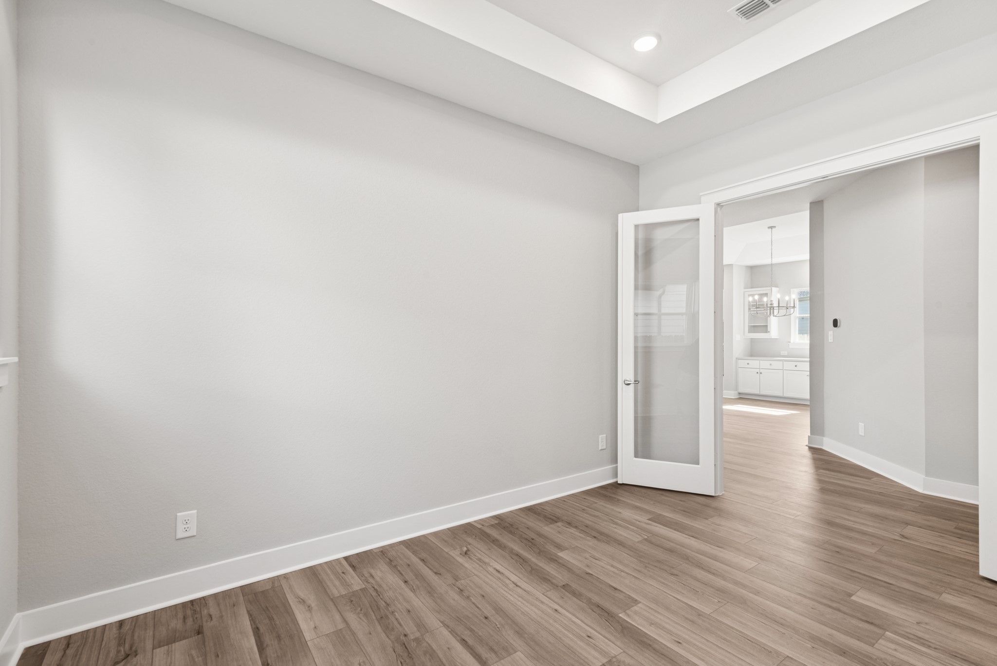 18623 Rumba Court Conroe, TX 77302 - Photo 24 of 48 a view of an empty room with wooden floor