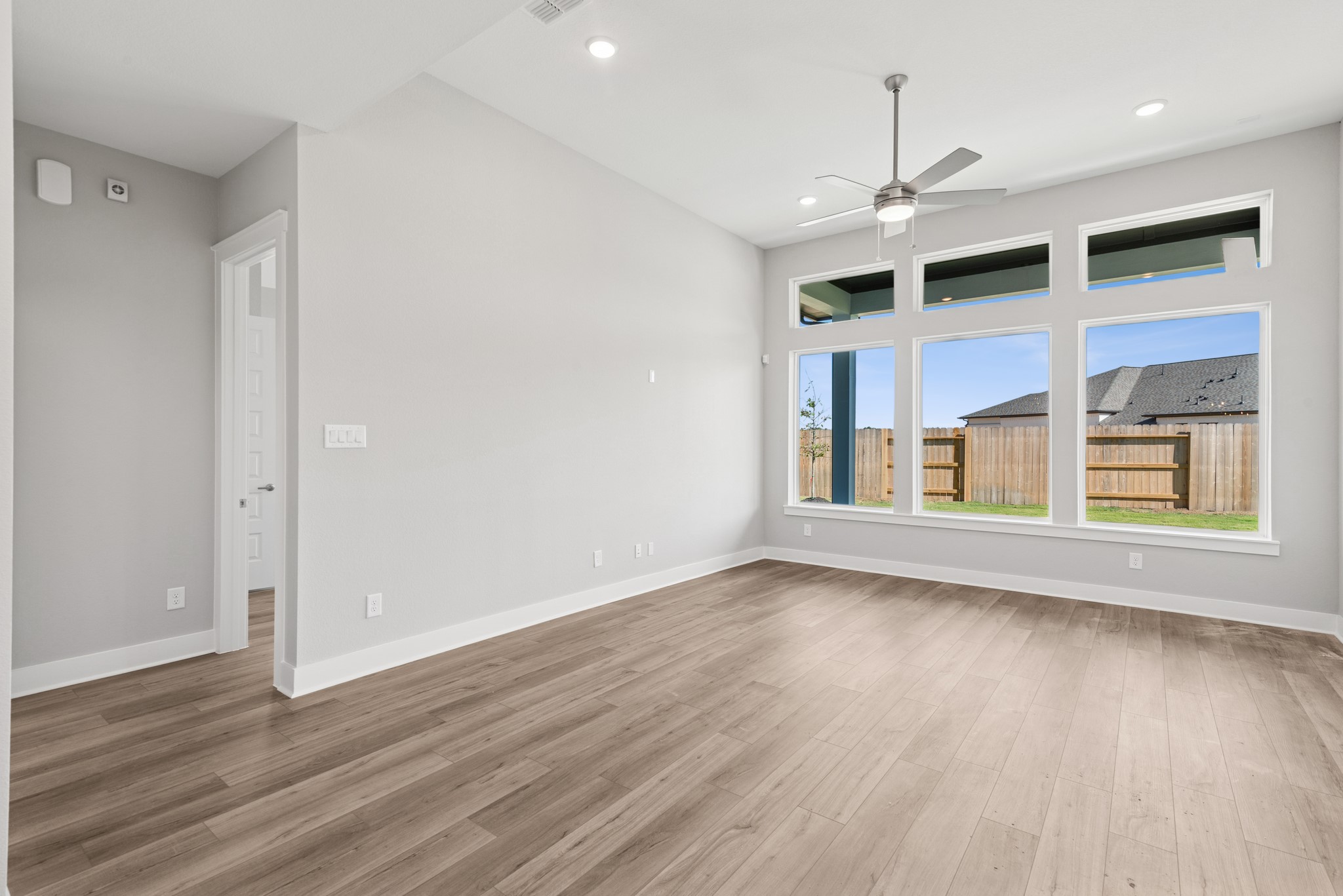 18623 Rumba Court Conroe, TX 77302 - Photo 32 of 48 a view of an empty room with wooden floor and a window