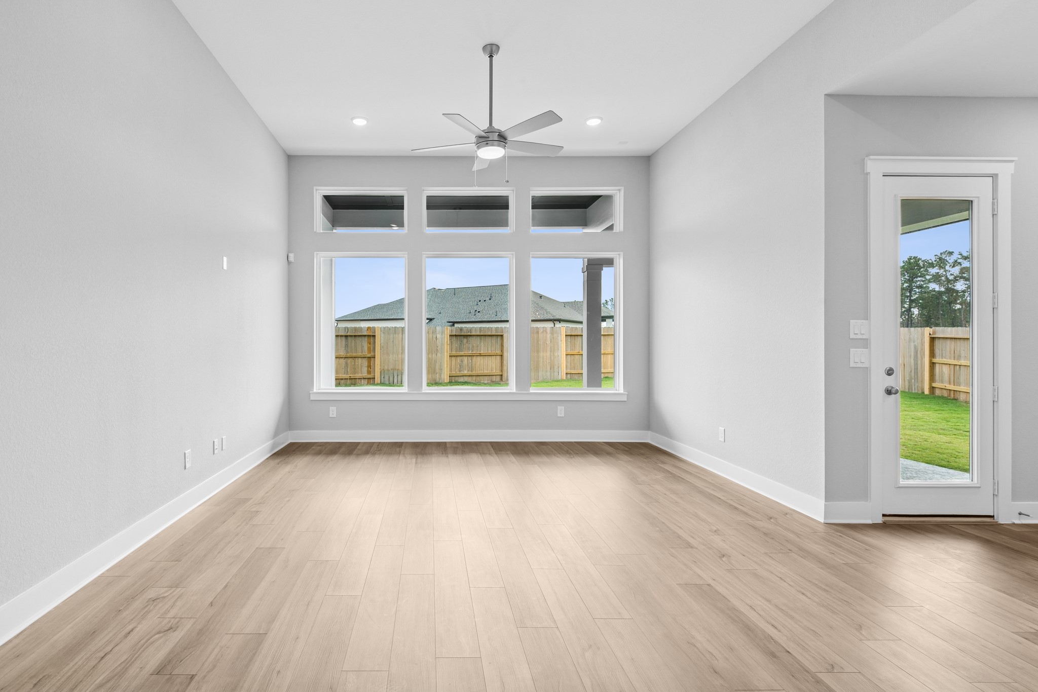 18623 Rumba Court Conroe, TX 77302 - Photo 33 of 48 wooden floor in an empty room with a window