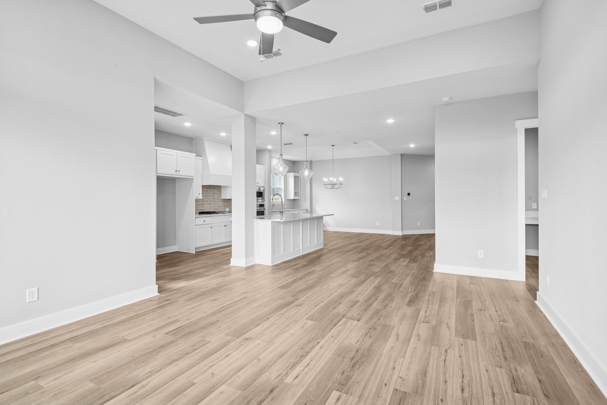 18623 Rumba Court Conroe, TX 77302 - Photo 34 of 48 a view of kitchen with wooden floor and window