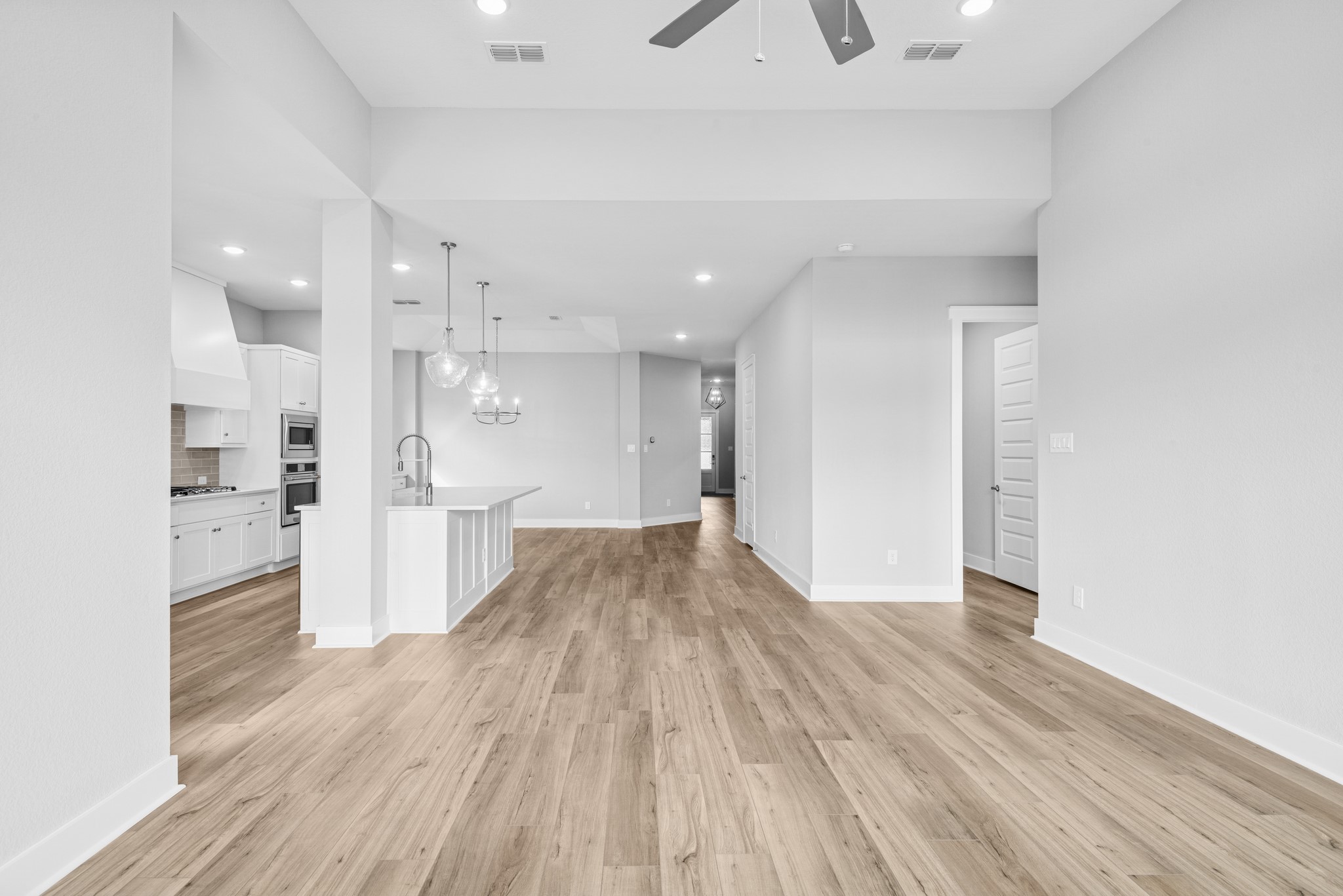 18623 Rumba Court Conroe, TX 77302 - Photo 35 of 48 a view of a kitchen with wooden floor