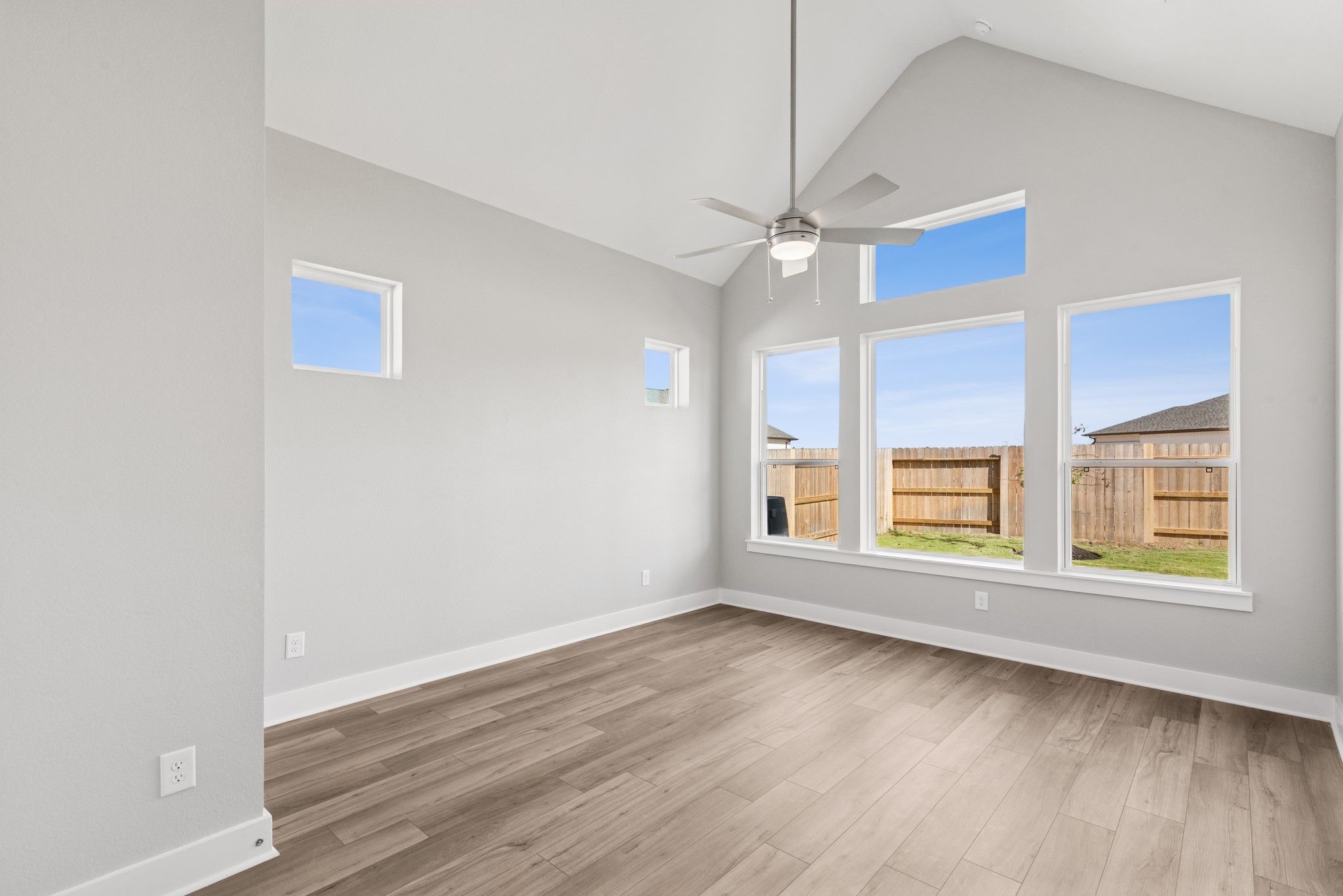 18623 Rumba Court Conroe, TX 77302 - Photo 38 of 48 an empty room with wooden floor and windows