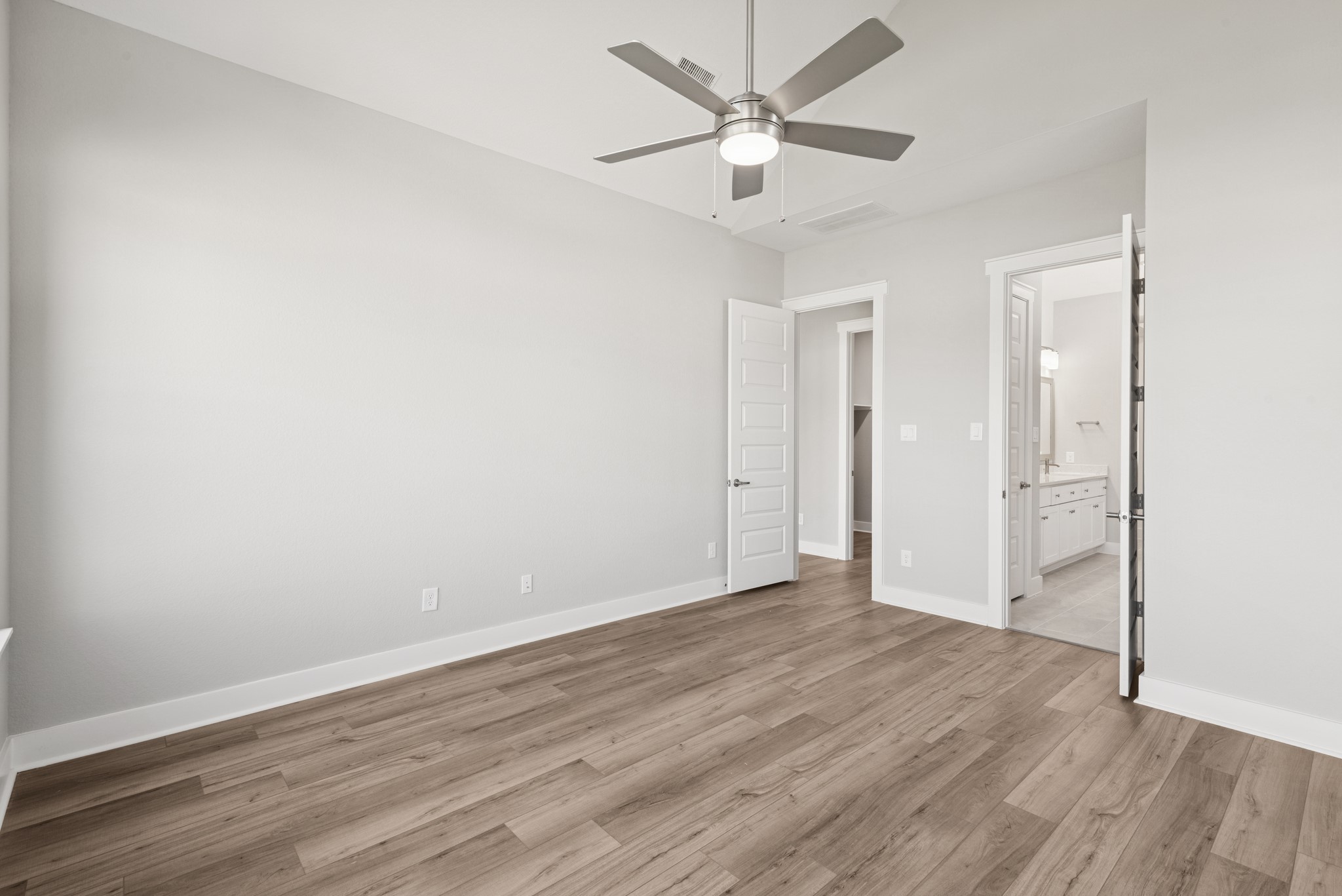 18623 Rumba Court Conroe, TX 77302 - Photo 39 of 48 an empty room with wooden floor and ceiling fan