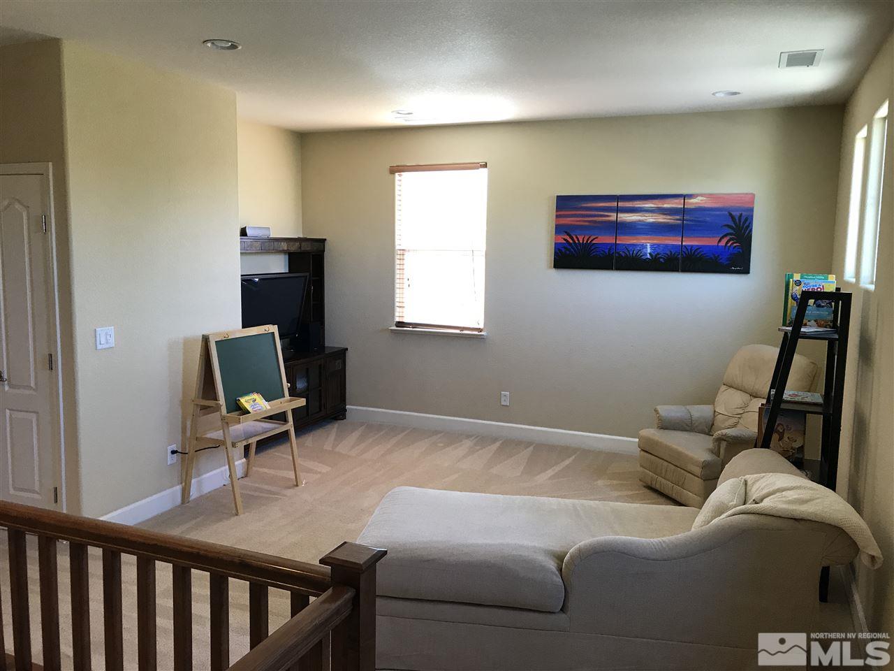 495 Terracina Way Reno, NV 89521 - Photo 12 of 25 a living room with furniture and a flat screen tv