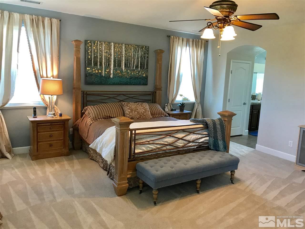 495 Terracina Way Reno, NV 89521 - Photo 14 of 25 a bedroom with a bed and window