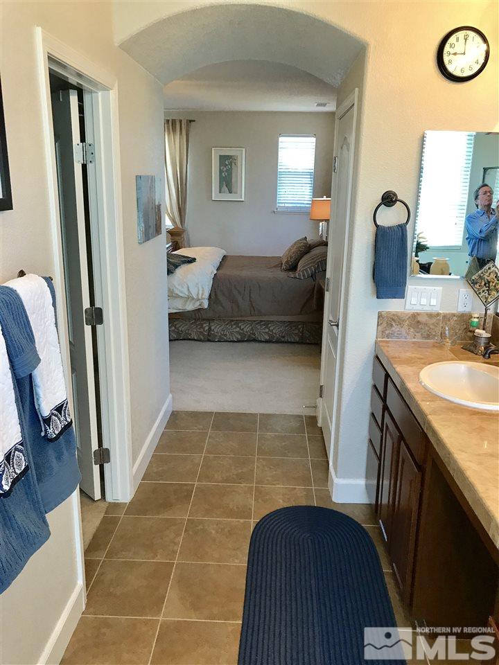 495 Terracina Way Reno, NV 89521 - Photo 17 of 25 a en suite bathroom with a sink and a mirror