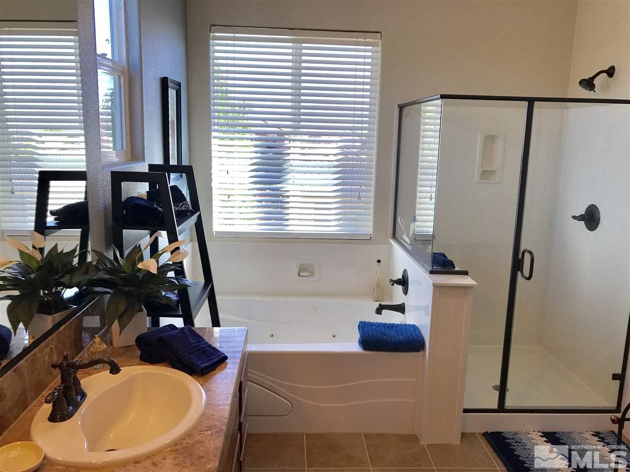 495 Terracina Way Reno, NV 89521 - Photo 18 of 25 a bathroom with a sink and a mirror