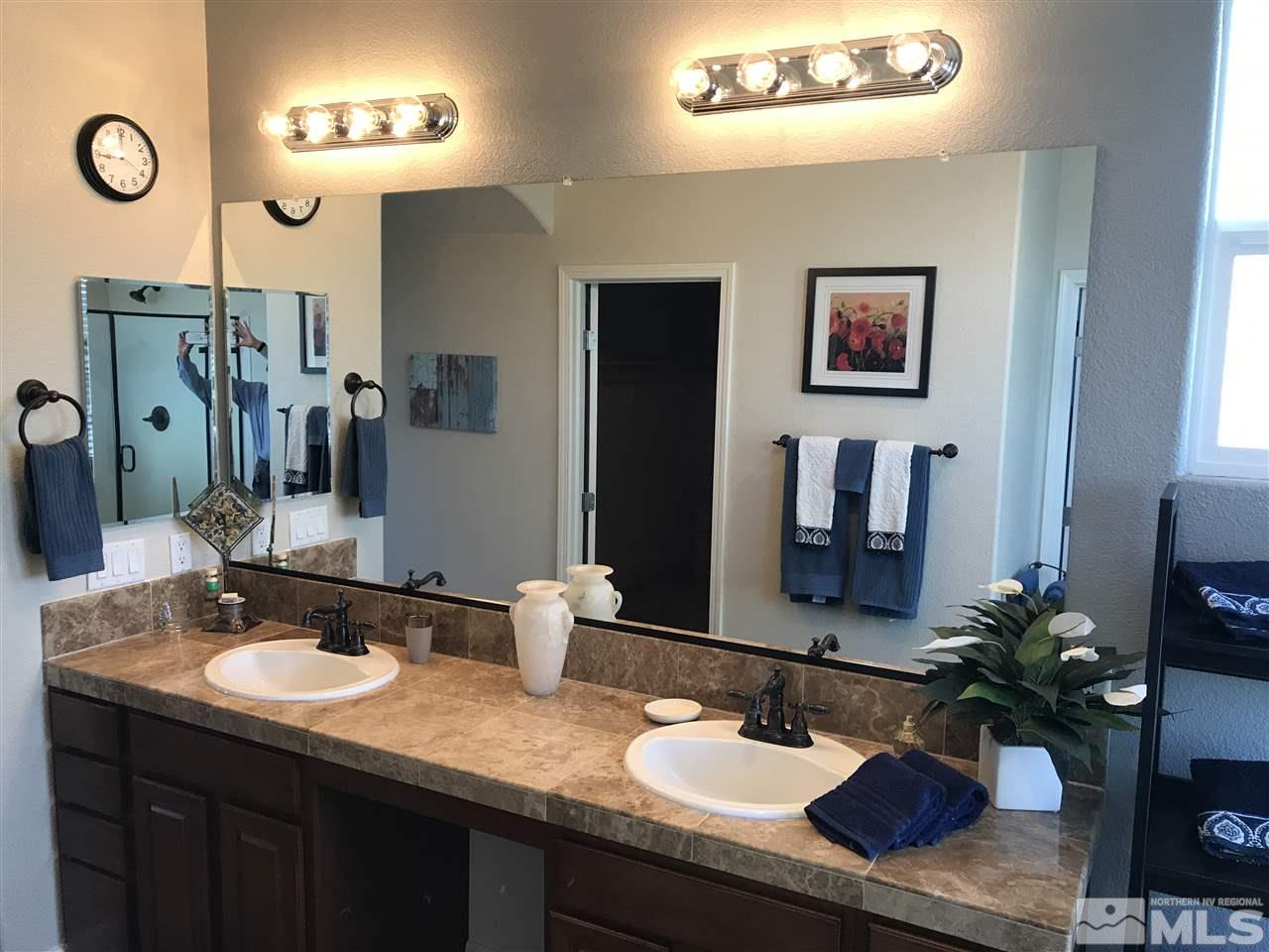 495 Terracina Way Reno, NV 89521 - Photo 19 of 25 a bathroom with a sink double vanity granite and a mirror