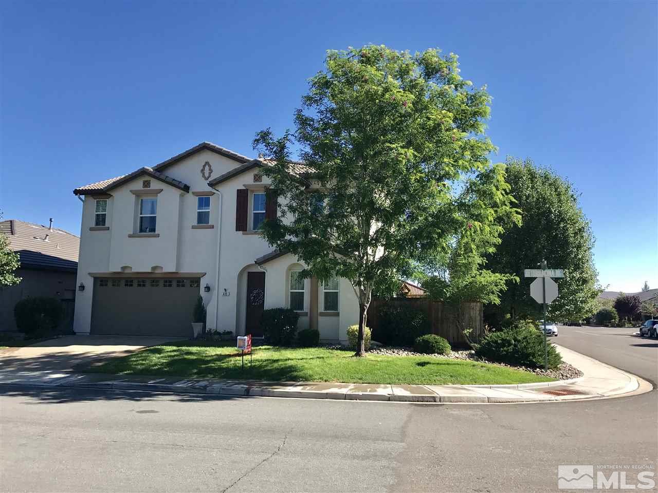 495 Terracina Way Reno, NV 89521 - Photo 2 of 25 a front view of a house with a yard and garage