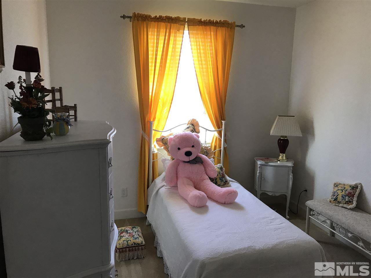 495 Terracina Way Reno, NV 89521 - Photo 21 of 25 a bedroom with a bed and a window