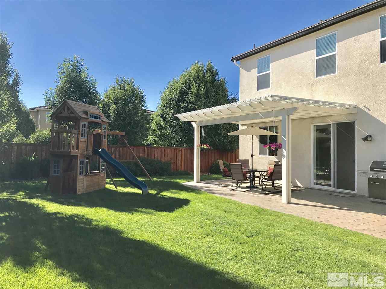 495 Terracina Way Reno, NV 89521 - Photo 25 of 25 a view of a chair and table in backyard of the house