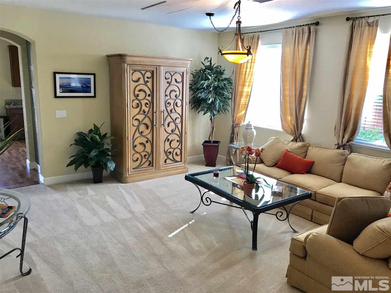 495 Terracina Way Reno, NV 89521 - Photo 7 of 25 a living room with furniture and a large window