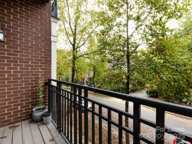 a view of a balcony with wooden floor
