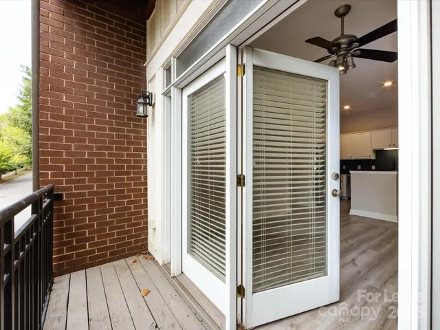 a view of a balcony with a door