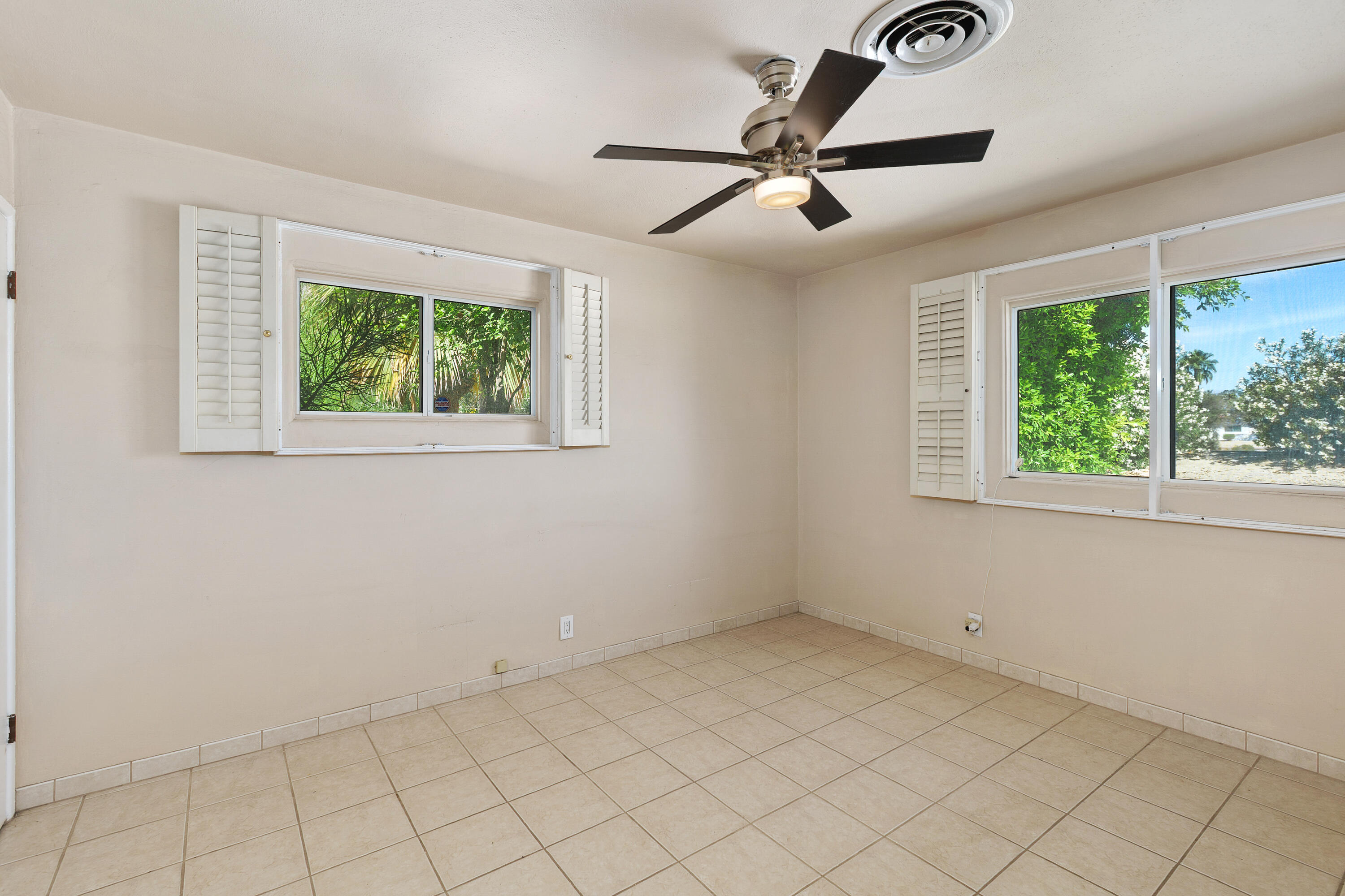 1077 South Riverside Drive Palm Springs, CA 92264 - Photo 21 of 35 a view of an empty room with a window