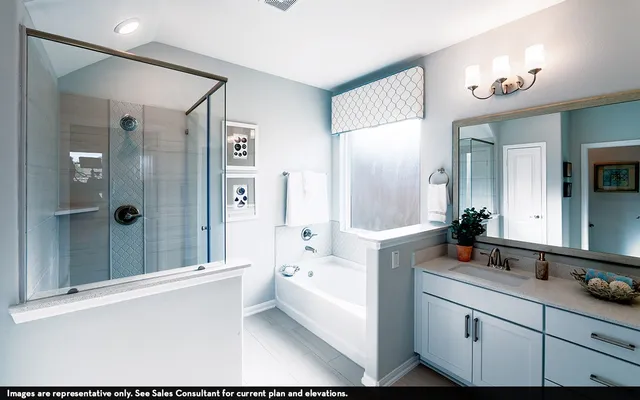 a bathroom with a bathtub shower sink and mirror