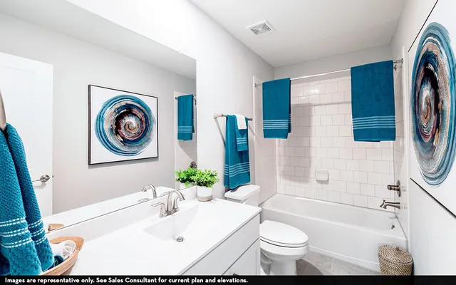 a bathroom with a sink a toilet and a bathtub