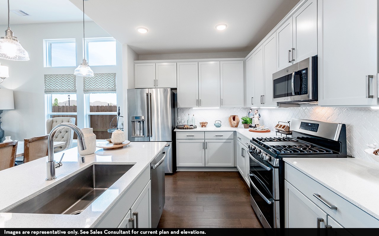 1722 Navigation Lane Angleton, TX 77515 - Photo 5 of 21 a kitchen with a sink stove and refrigerator