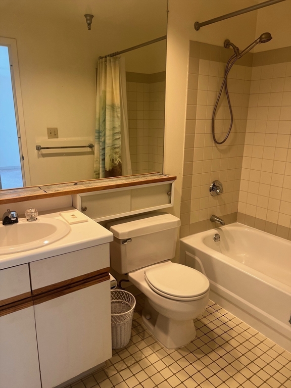 750 Davol Street, Unit 616 Fall River, MA 02720 - Photo 17 of 17 a bathroom with a sink a toilet and a bathtub