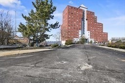 750 Davol Street, Unit 616 Fall River, MA 02720 - Photo 3 of 17 a view of a tall building next to a road