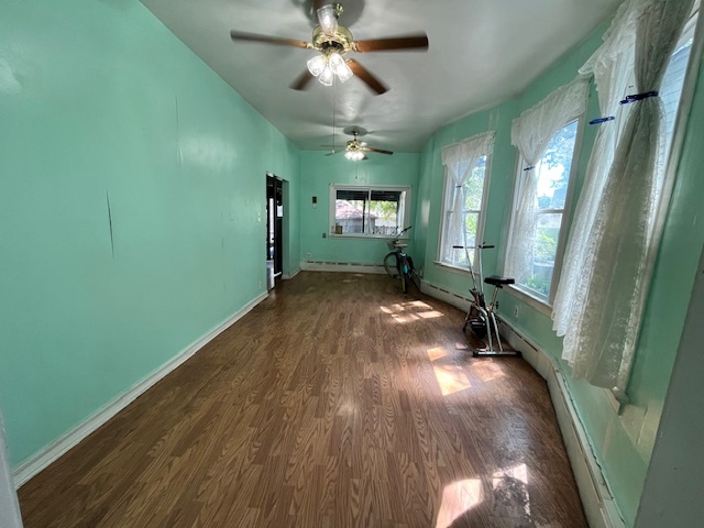 3651 West 64th Place Chicago, IL 60629 - Photo 13 of 35 a view of a livingroom with a hardwood and a ceiling fan