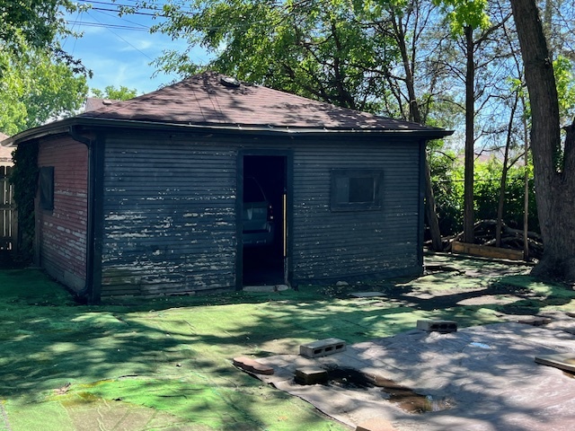 3651 West 64th Place Chicago, IL 60629 - Photo 35 of 35 a view of a wooden house with a small yard