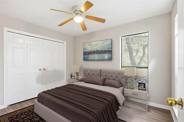 a bedroom with a large bed and a window