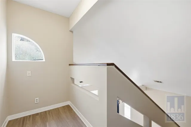 a view of a hallway with staircase