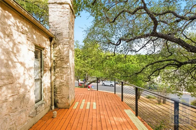 a view of balcony with wooden floor and outdoor space