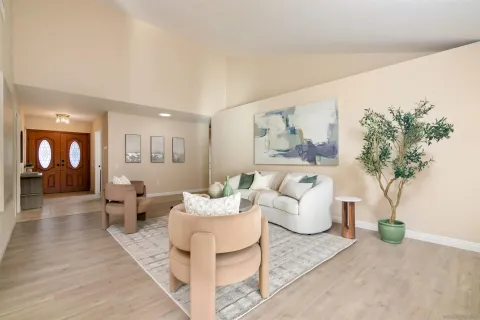 a living room with furniture and a potted plant