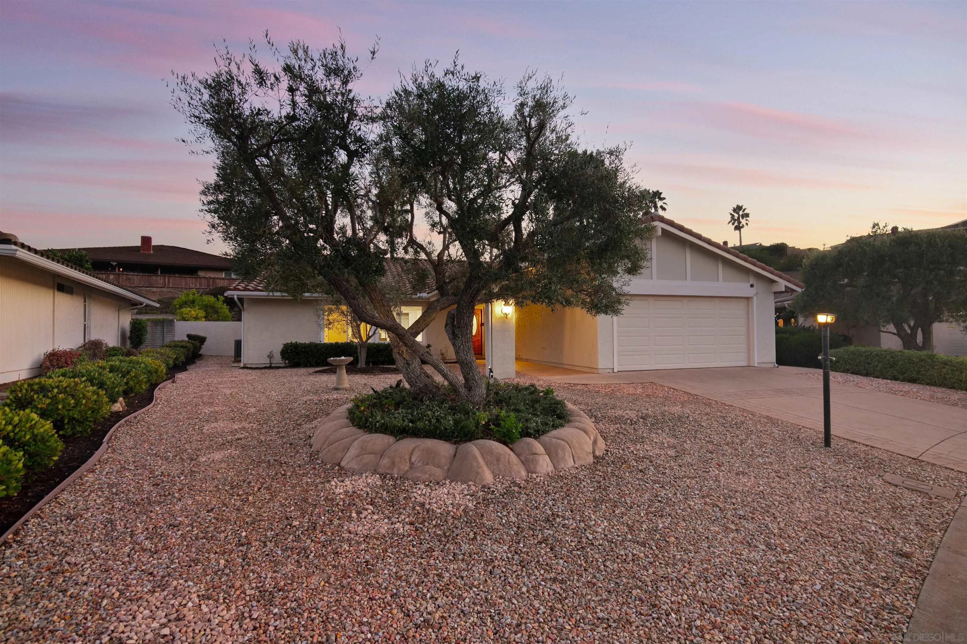 12607 Opimo Drive San Diego, CA 92128 - Photo 2 of 48 a front view of a house with garden