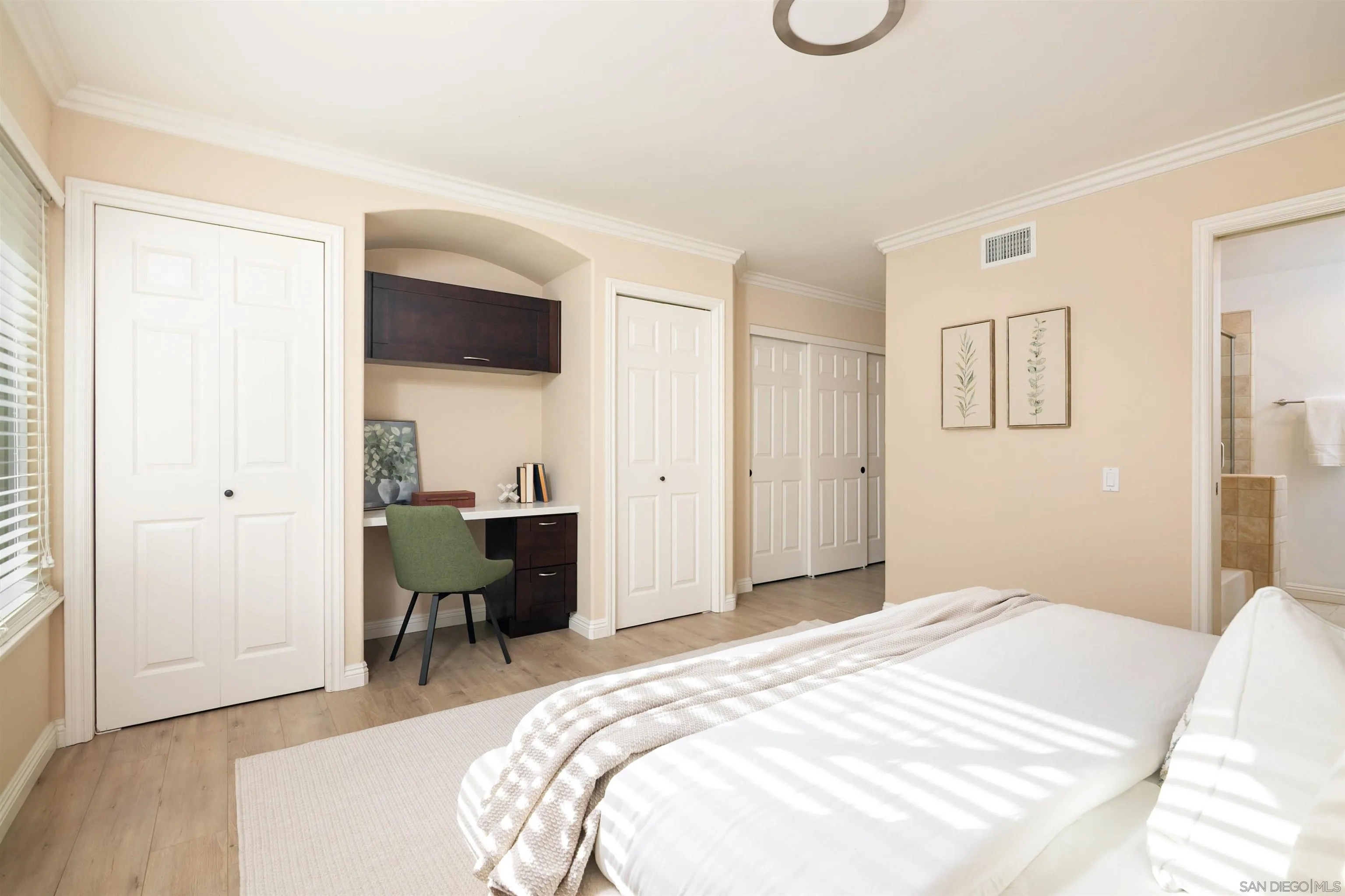 12607 Opimo Drive San Diego, CA 92128 - Photo 23 of 48 a bedroom with a bed and a chair with the wooden floor