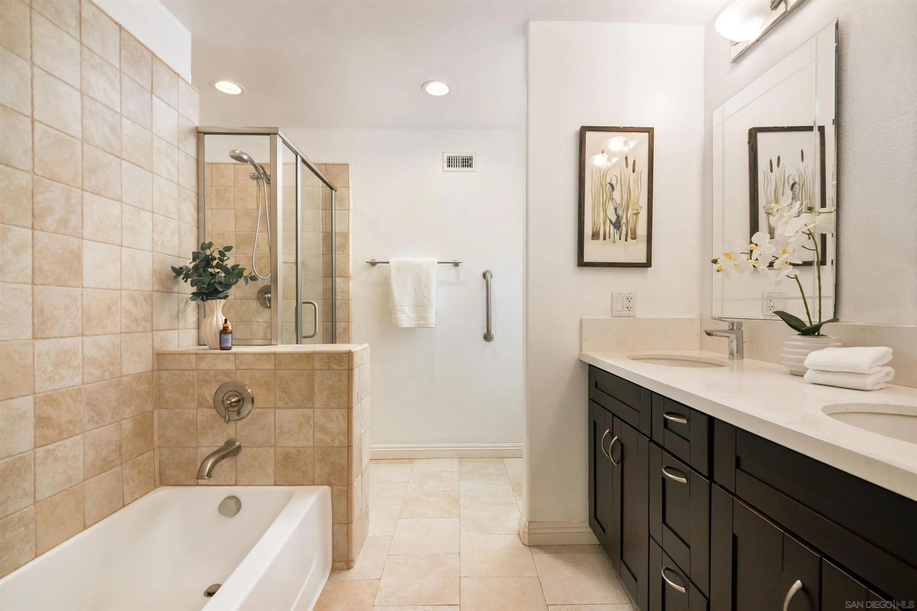 12607 Opimo Drive San Diego, CA 92128 - Photo 24 of 48 a bathroom with a tub a sink shower and mirror