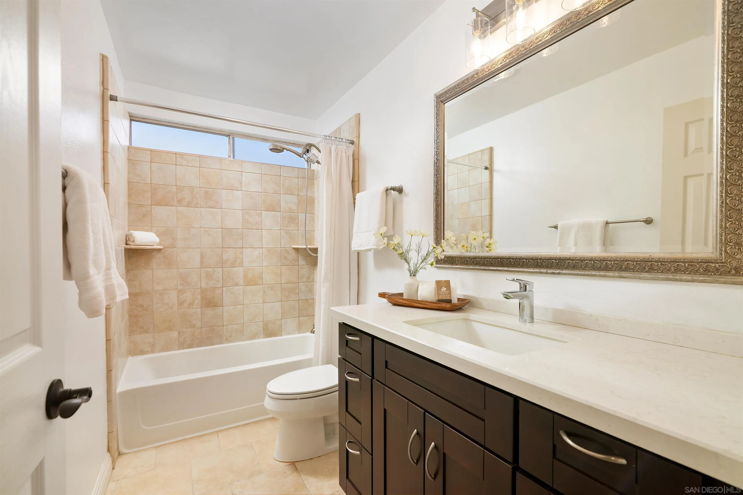 12607 Opimo Drive San Diego, CA 92128 - Photo 28 of 48 a bathroom with a double vanity sink toilet mirror and shower
