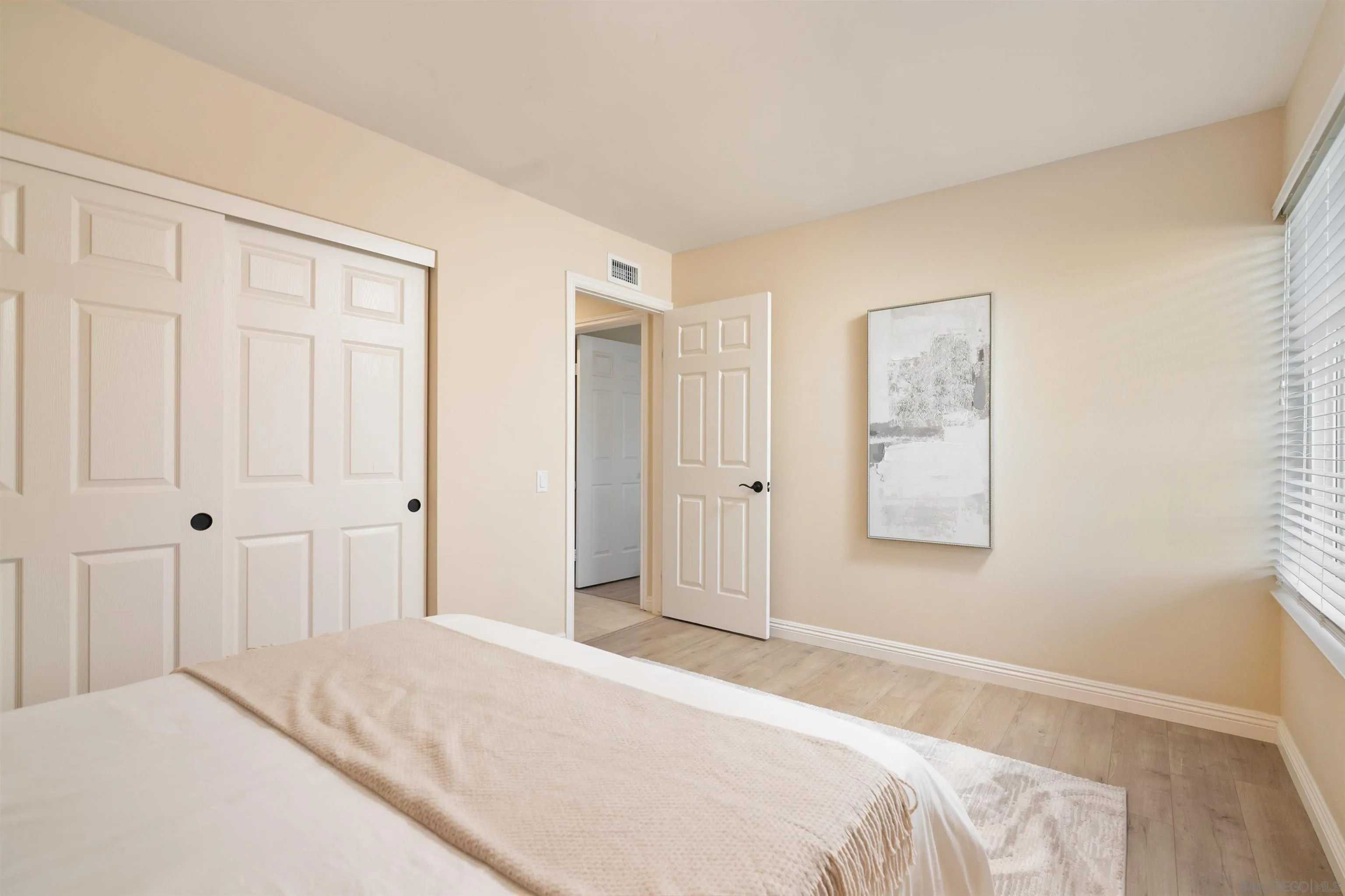 12607 Opimo Drive San Diego, CA 92128 - Photo 30 of 48 a bedroom with a bed and a window