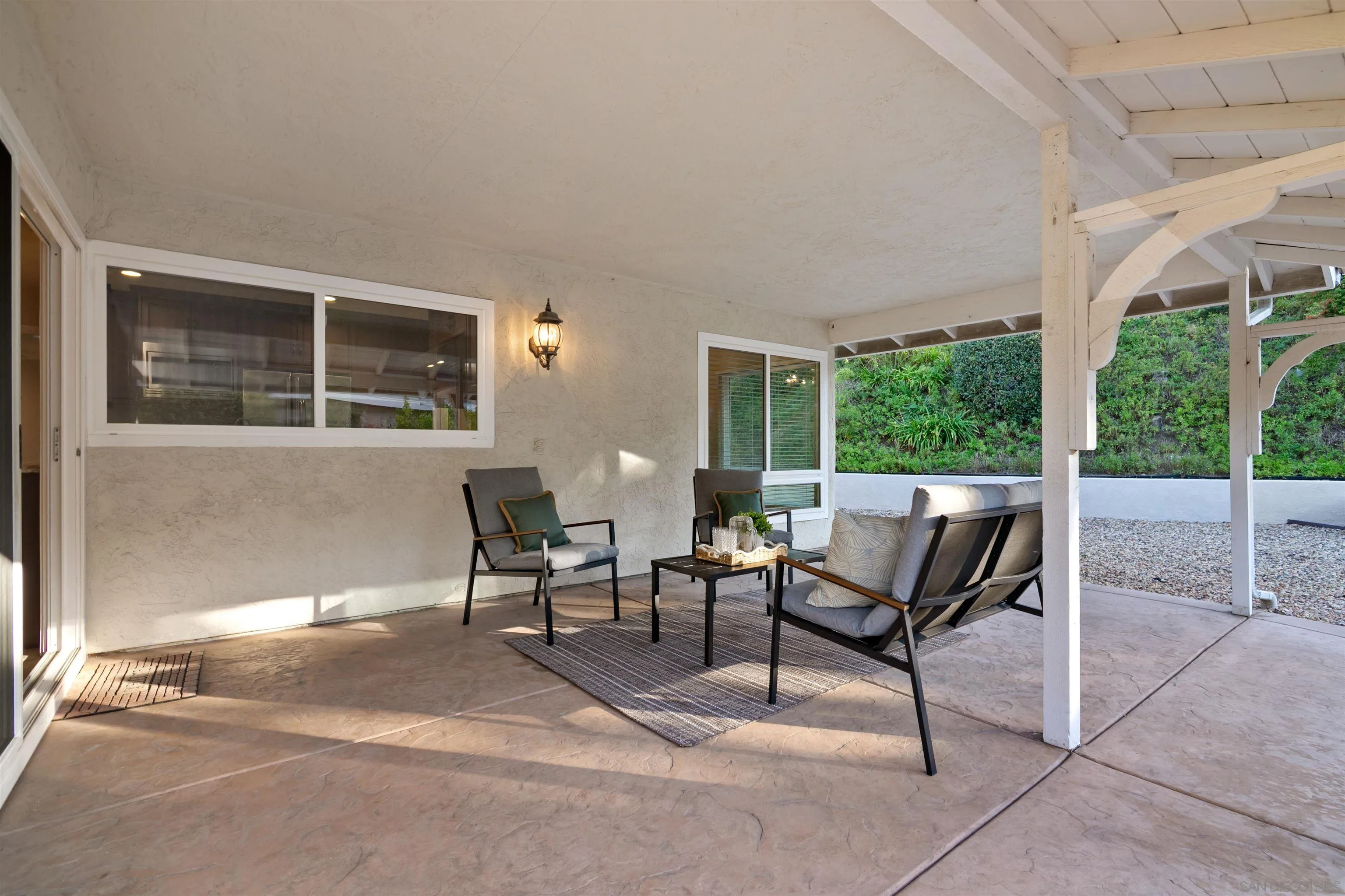 12607 Opimo Drive San Diego, CA 92128 - Photo 35 of 48 a view of a patio with a table and chairs