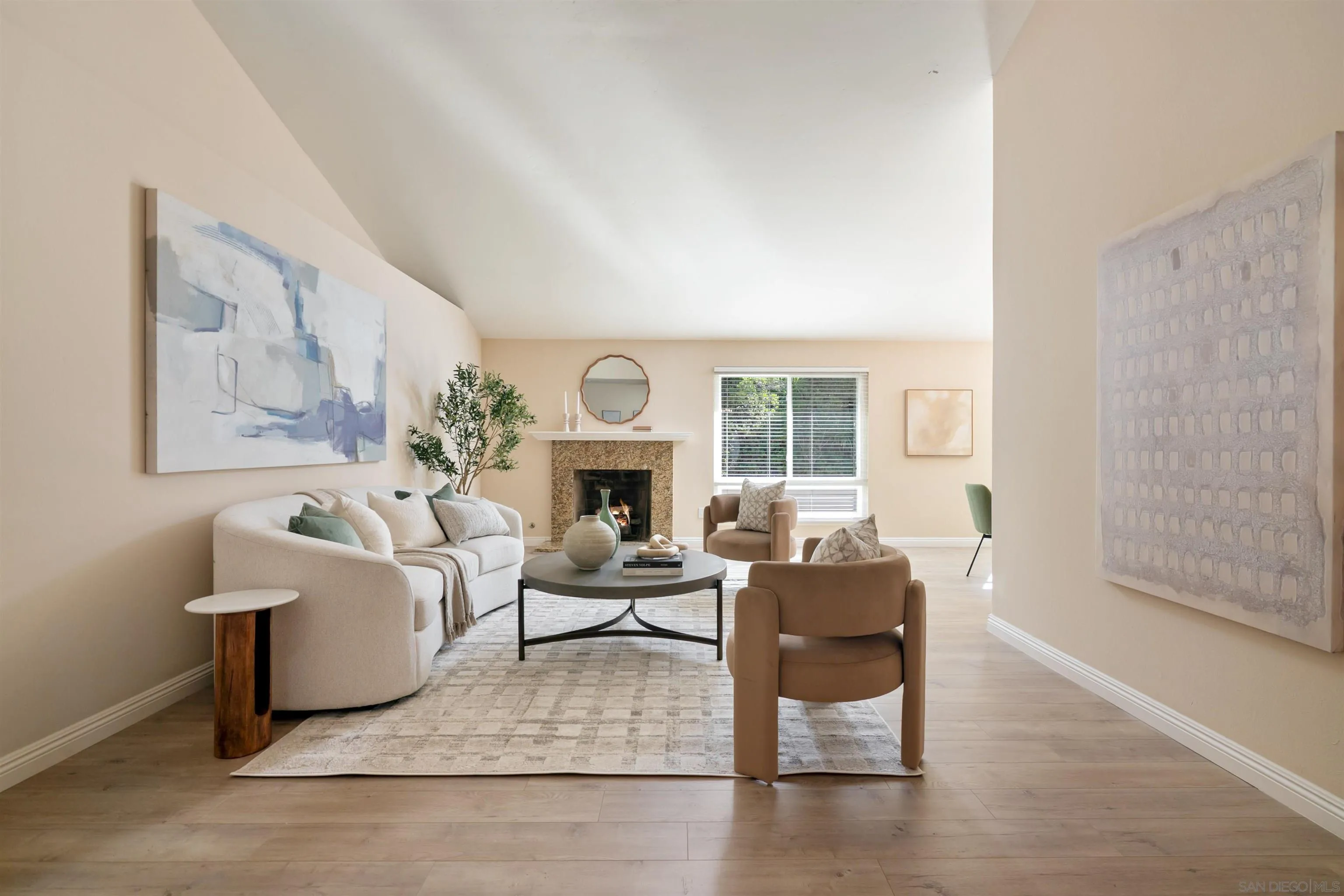 12607 Opimo Drive San Diego, CA 92128 - Photo 10 of 48 a living room with furniture a fireplace and a large window