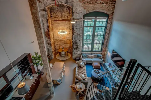 a view of hallway with furniture and a window