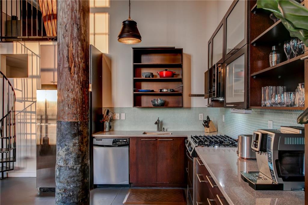 170 Boulevard Southeast, Unit E404 Atlanta, GA 30312 - Photo 12 of 42 a kitchen with a sink and cabinets