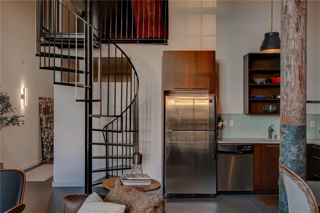 170 Boulevard Southeast, Unit E404 Atlanta, GA 30312 - Photo 13 of 42 a kitchen with stainless steel appliances granite countertop a refrigerator and a sink