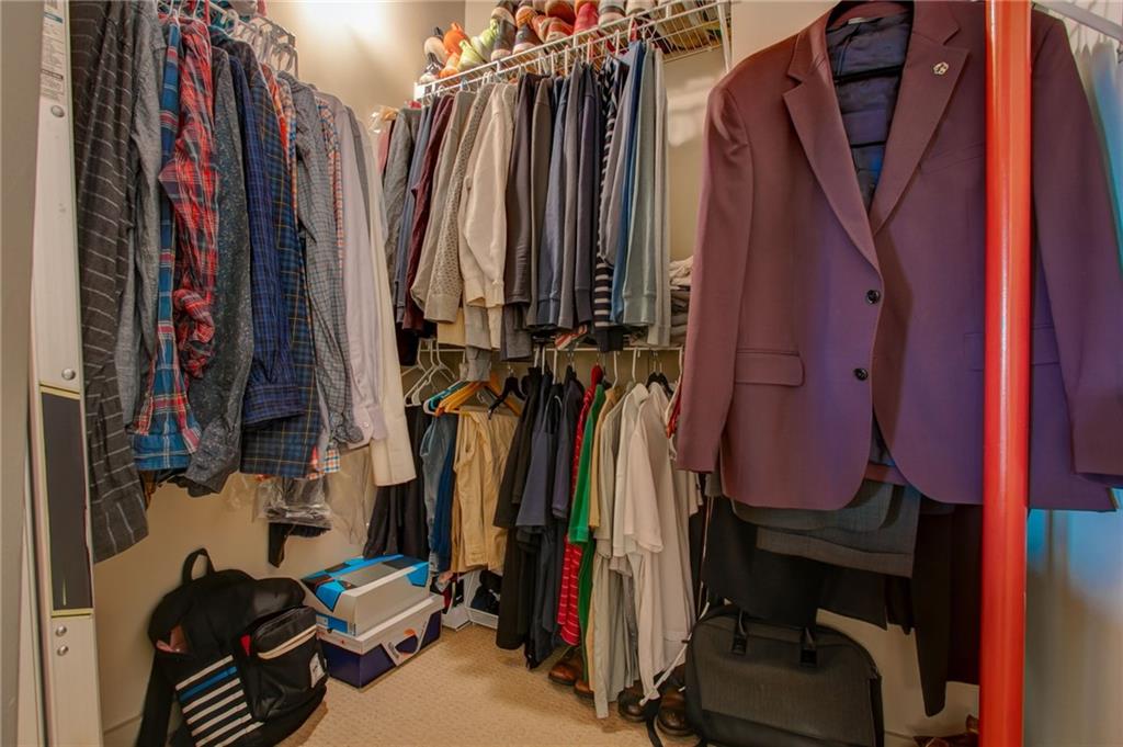 170 Boulevard Southeast, Unit E404 Atlanta, GA 30312 - Photo 17 of 42 a view of walk in closet with clothes