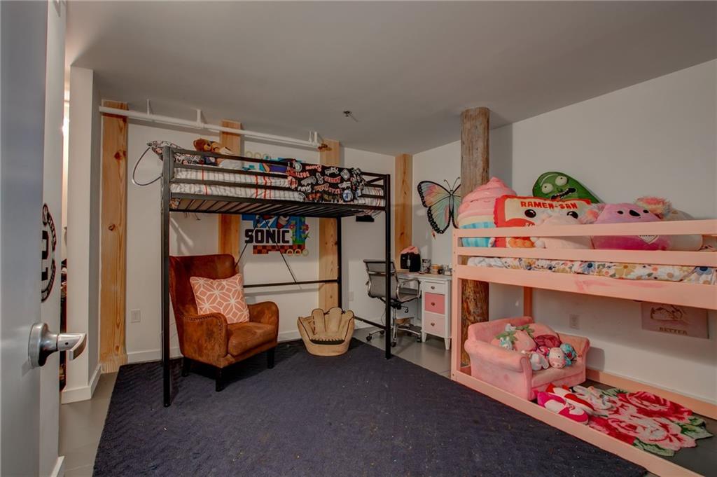 170 Boulevard Southeast, Unit E404 Atlanta, GA 30312 - Photo 21 of 42 a bedroom with baby bed and window
