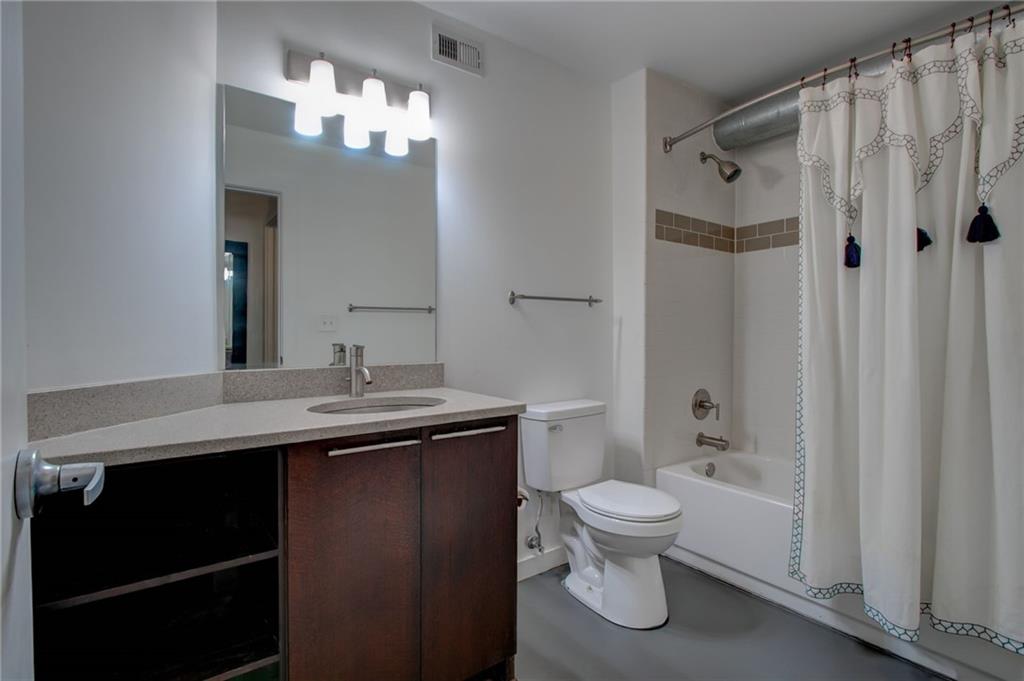 170 Boulevard Southeast, Unit E404 Atlanta, GA 30312 - Photo 25 of 42 a bathroom with a sink a toilet and shower